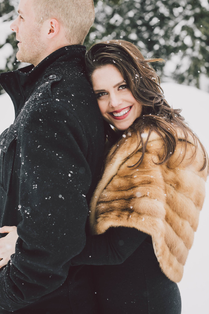 Classic fur coat for their snow engagement photos