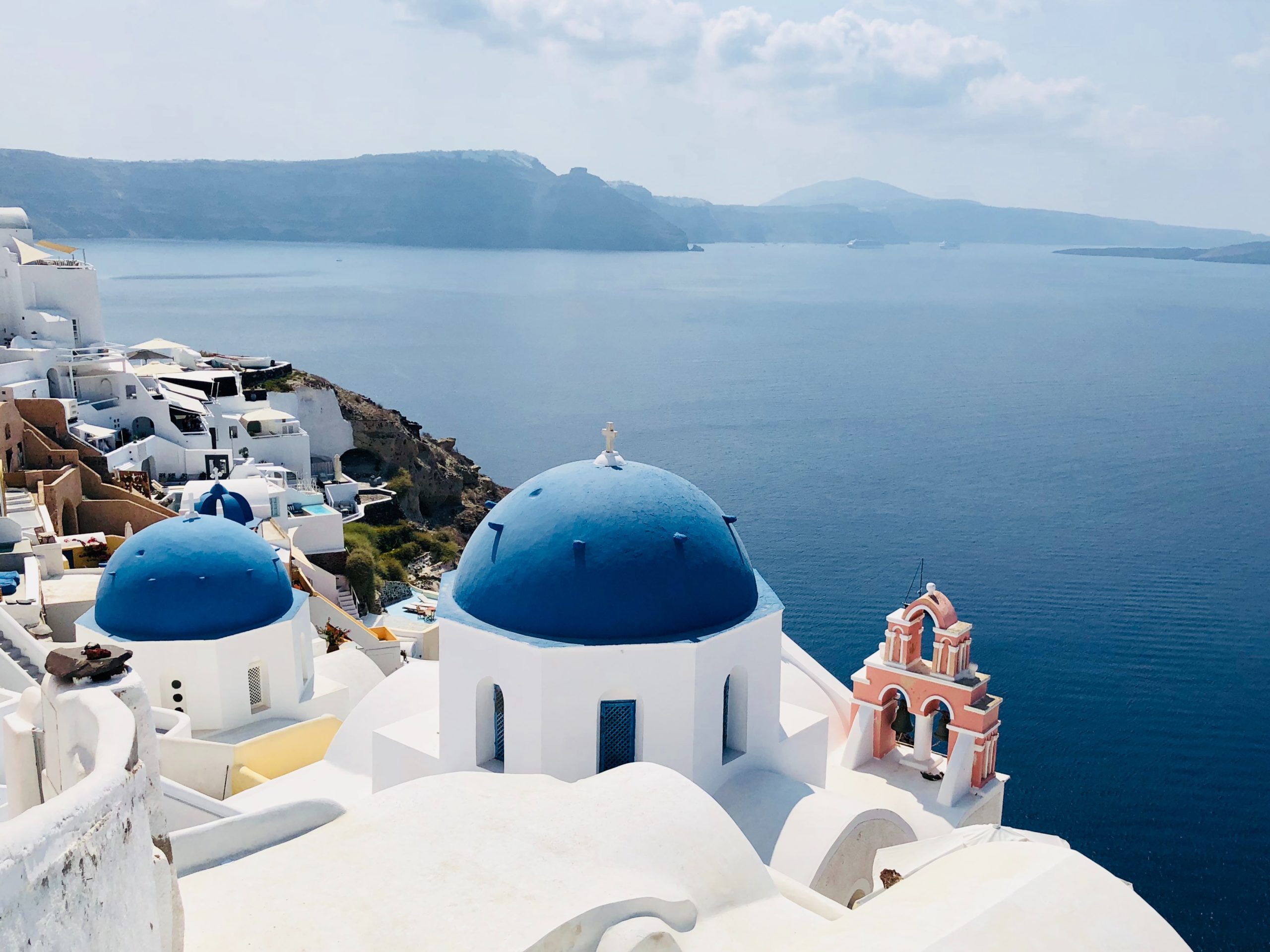 The blue domes of Santorini act as your backdrop for your wedding day